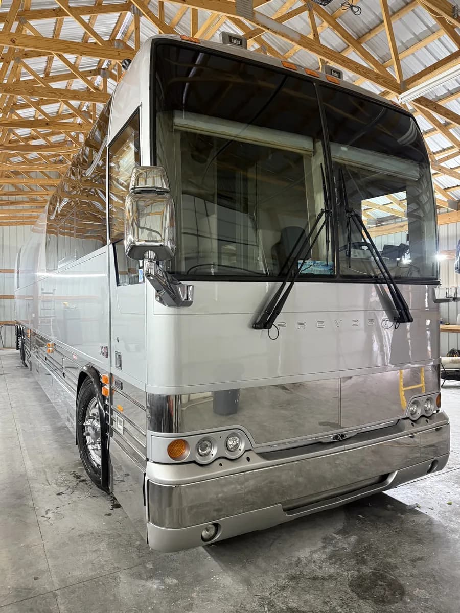 Completed Prevost X3-45 luxury motorcoach with fresh silver pearl paint at Nations RV in Lyles, Tennessee
